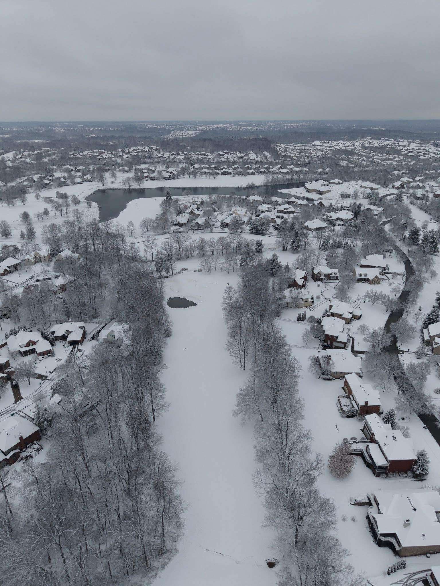 Frozen golf course and neighborhood snow